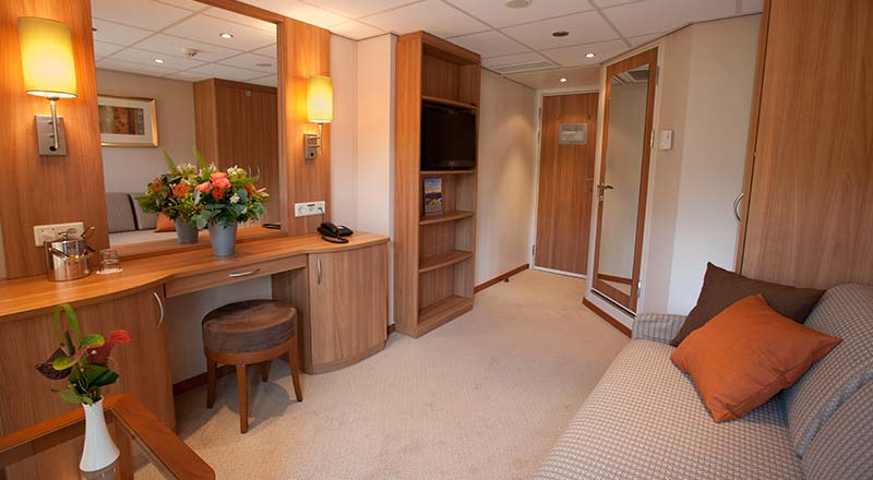 The living room of a Standard stateroom on board a Viking river ship