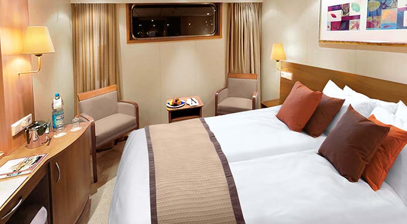 Bed of a Standard stateroom on board a Viking river ship