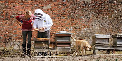 Karine Hagen with Mike the Beekeeper at Highclere Castle