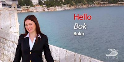 A woman dressed in a blazer standing over water, with the words "Hello" "Bok" "Bokh" in text.